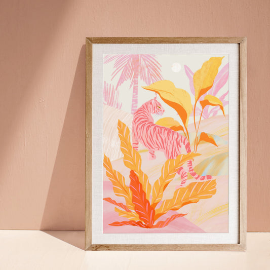 Framed artwork with a pink tiger and orange leaves on a beige wall