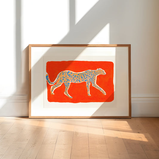 High quality giclée print of a gouache painting by watercolor artist Sun Lee. Features a cheetah walking in profile on a vermilion background. Aesthetic watercolor artwork combining elegance and bold simplicity.