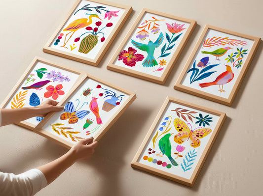 Set of six colorful framed artworks with floral and nature-themed designs on a white wall.