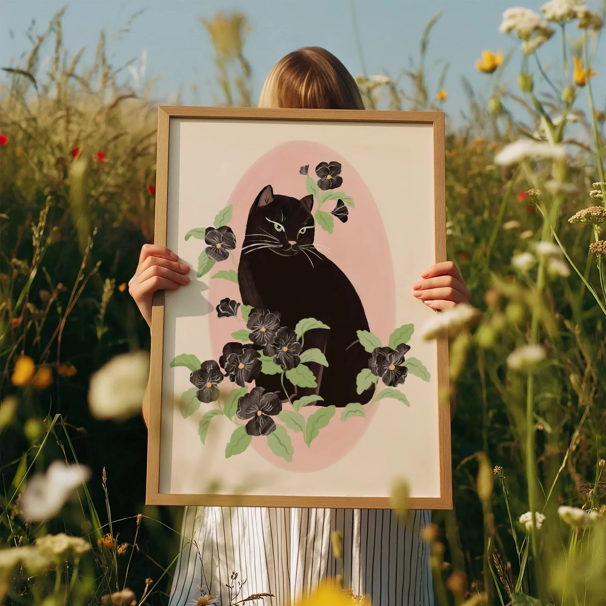 Vertical portrait illustration of a black cat surrounded by black pansy flowers, with a soft and feminine mood