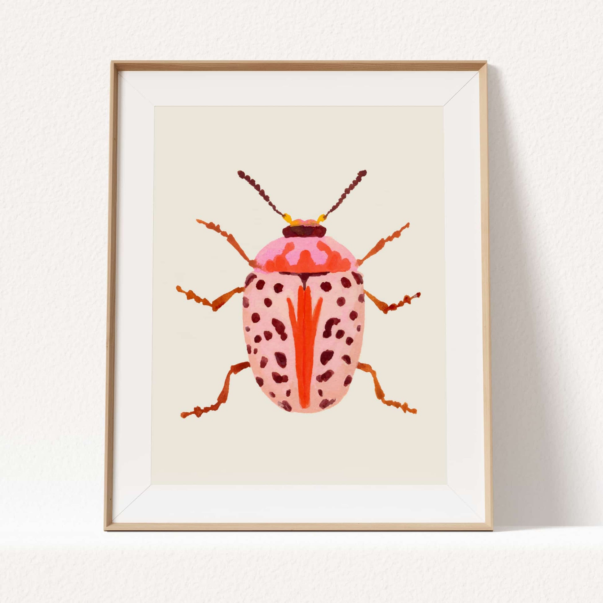 Gouache painting of a blush-colored beetle with coral and baby pink tones, accented with wine-maroon dots and curving tentacle-like antennae. A soft yet striking insect illustration.