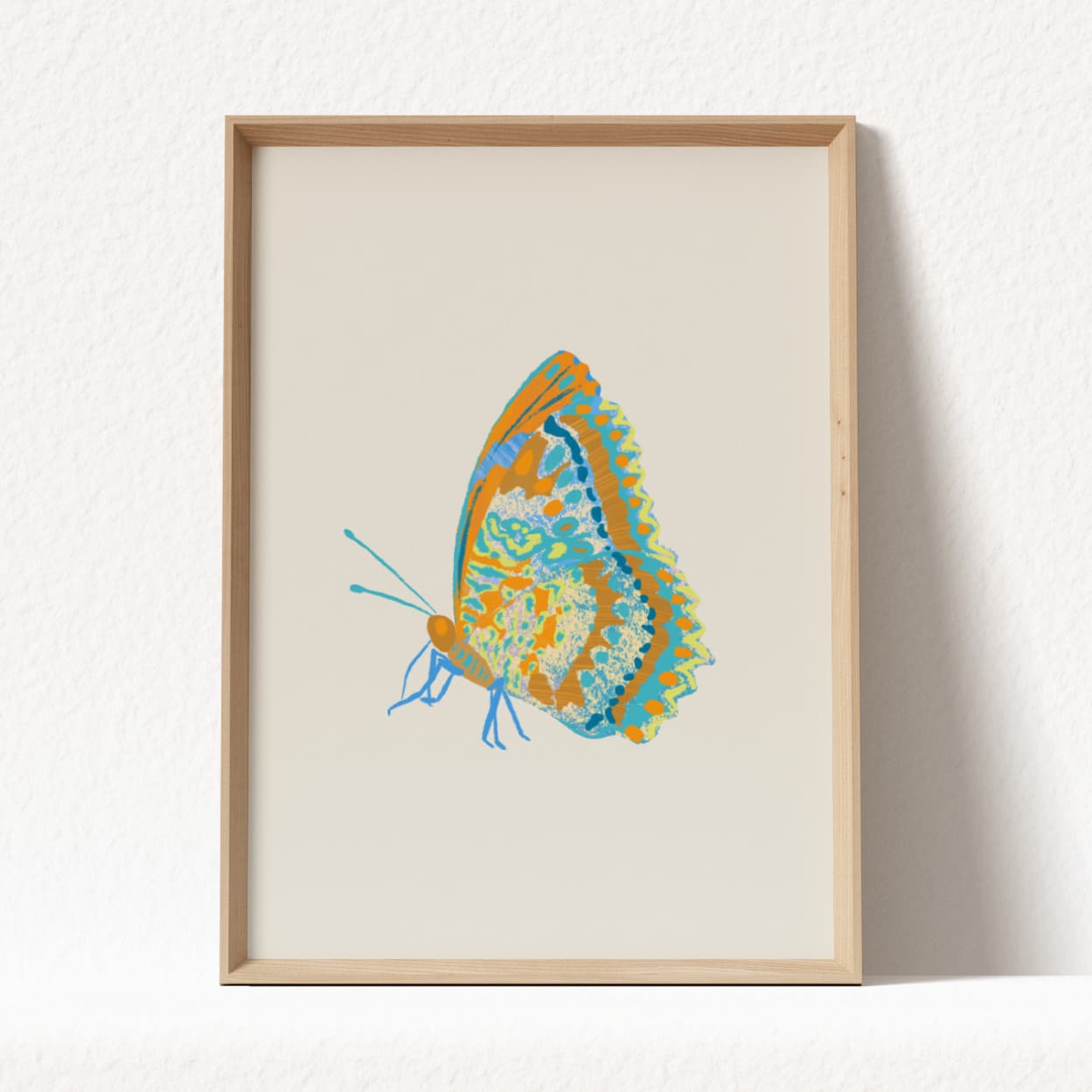 Framed artwork of a colorful butterfly on a white background