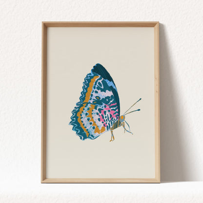 Framed artwork of a colorful butterfly on a beige background