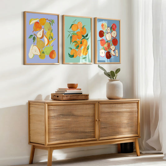 Set of three still life art prints featuring tangerines, apples, and pears in colorful arrangements.