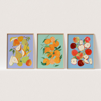 Set of three still life art prints featuring tangerines, apples, and pears in colorful arrangements.
