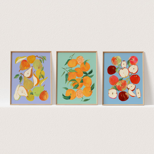 Set of three still life art prints featuring tangerines, apples, and pears in colorful arrangements.
