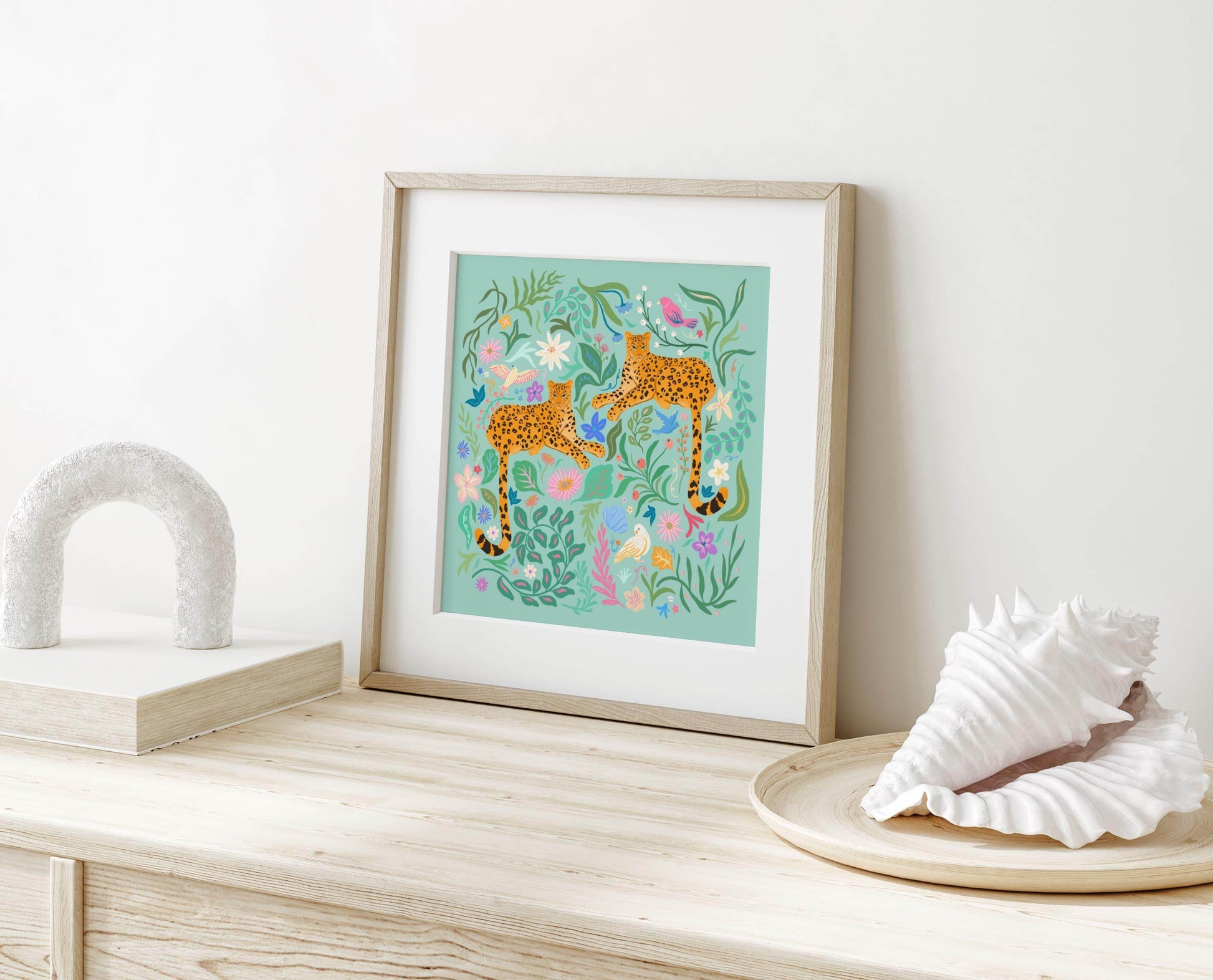 Playful illustration of cheetahs surrounded by colorful flowers, birds, and nature elements – vibrant and fun animal art print for nature-inspired home decor