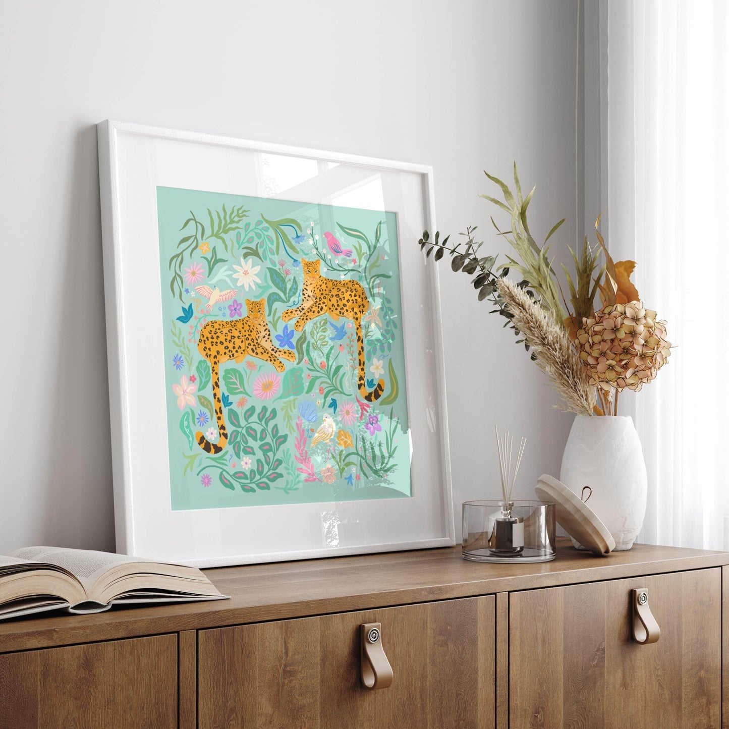 Playful illustration of cheetahs surrounded by colorful flowers, birds, and nature elements – vibrant and fun animal art print for nature-inspired home decor