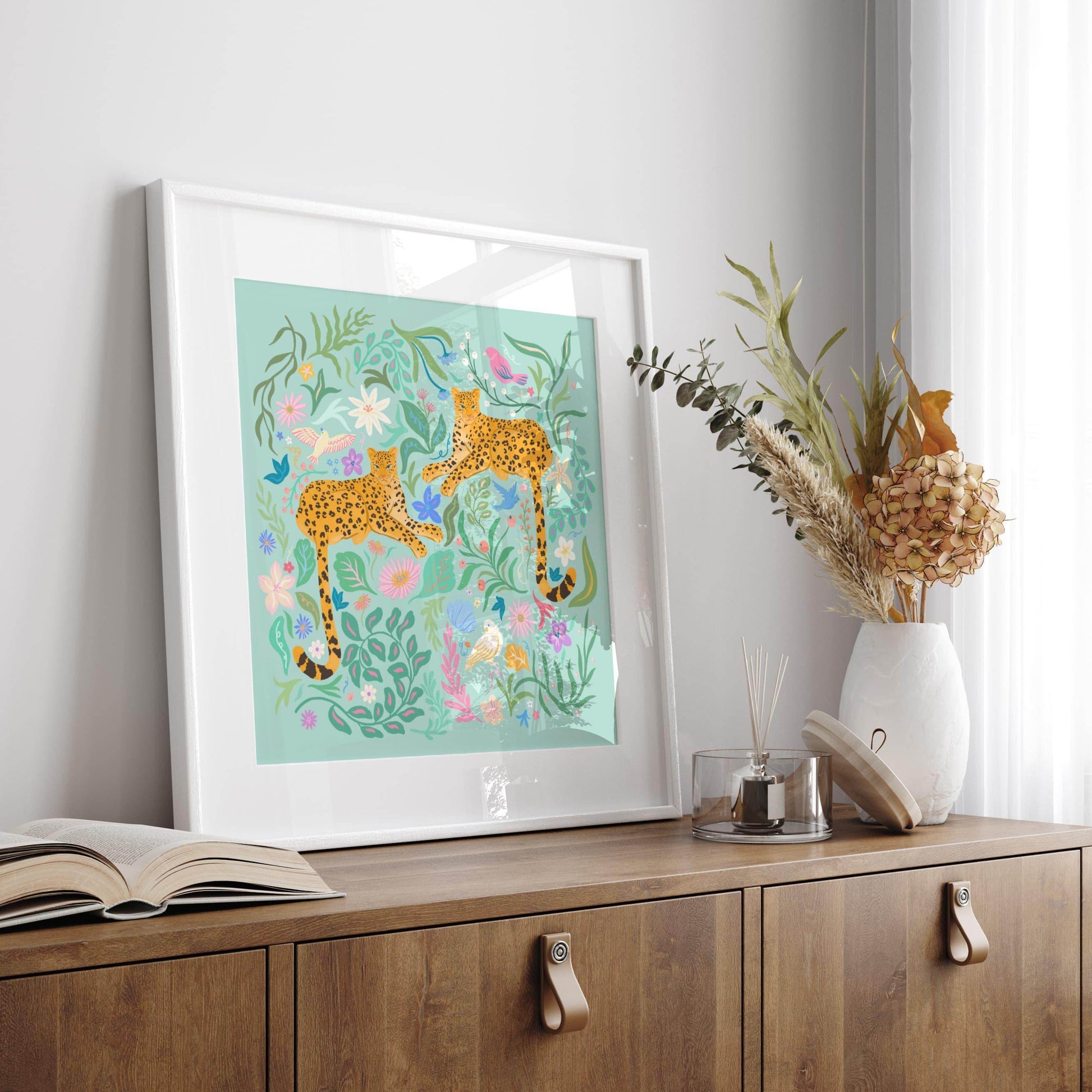 Playful illustration of cheetahs surrounded by colorful flowers, birds, and nature elements – vibrant and fun animal art print for nature-inspired home decor