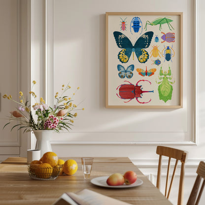 Dining room with a framed illustration of colorful insects on the wall, a table with fruit and flowers, and chairs.