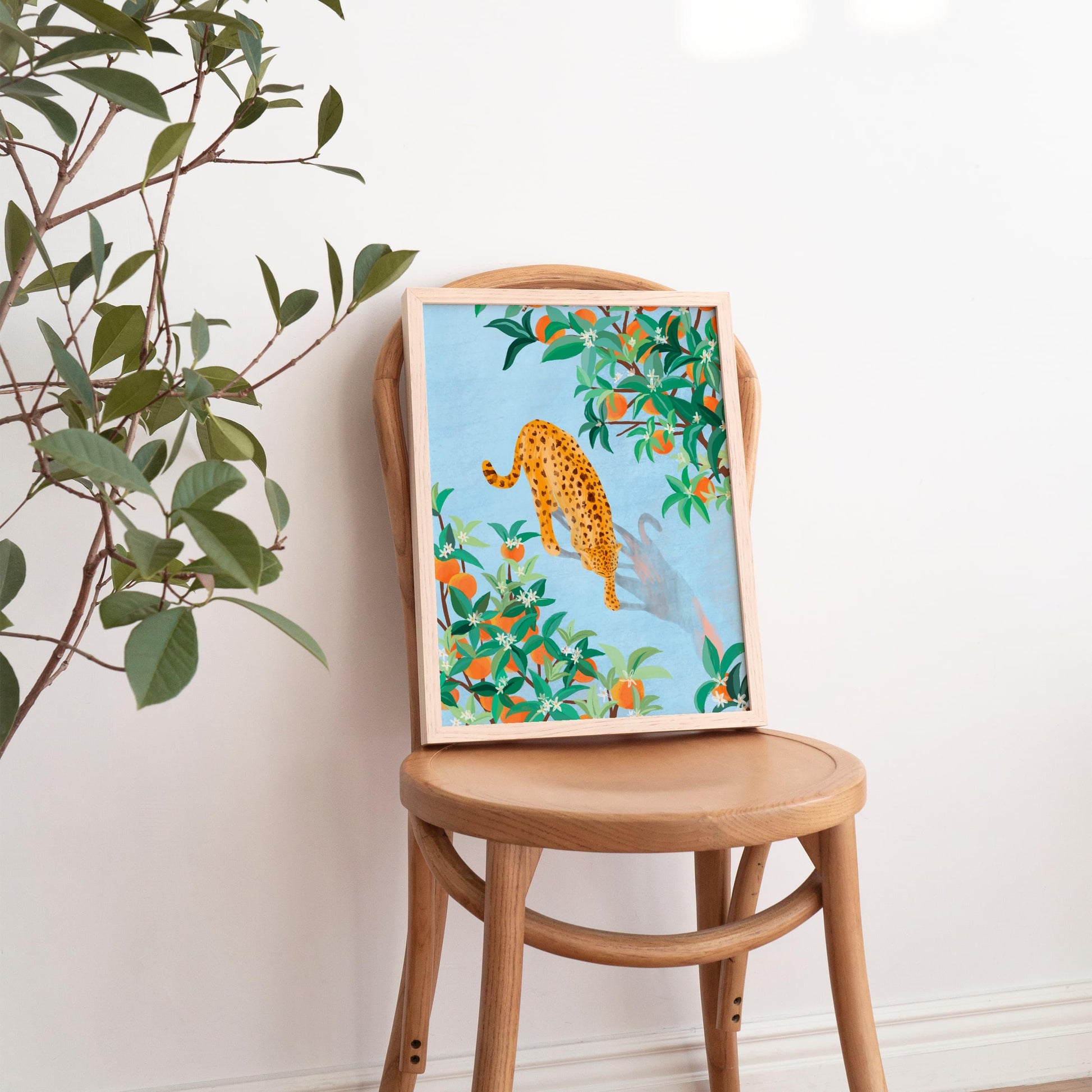 Wall art of a cheetah strolling gracefully through a grove of orange trees, with rich textures and vibrant oranges – nature-inspired animal art print for modern home decor
