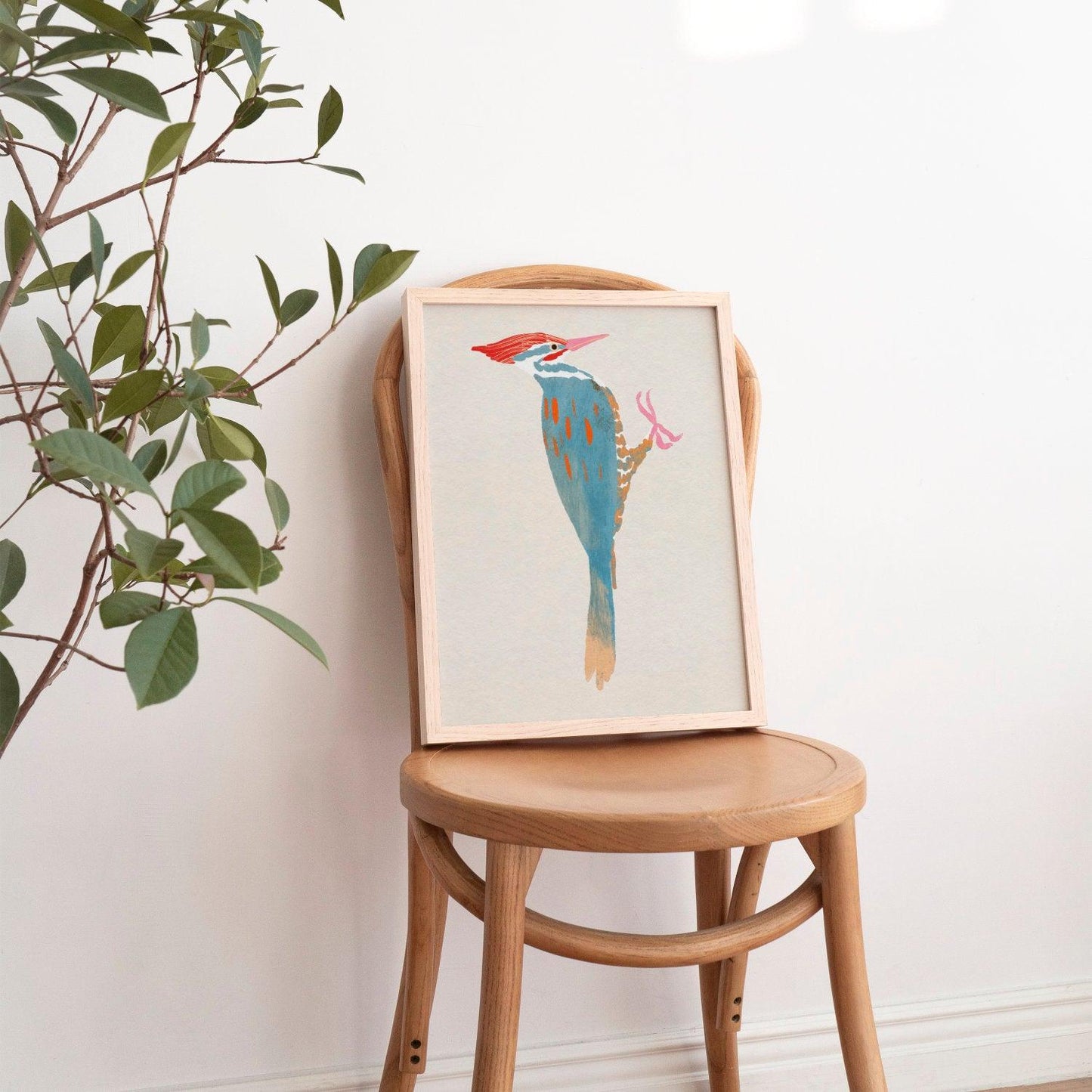 A whimsical art print of a Pileated Woodpecker, illustrated in vibrant colors and playful details. The bird is perched in a natural setting, capturing its bold features and lively spirit—an artistic tribute to this striking forest visitor.