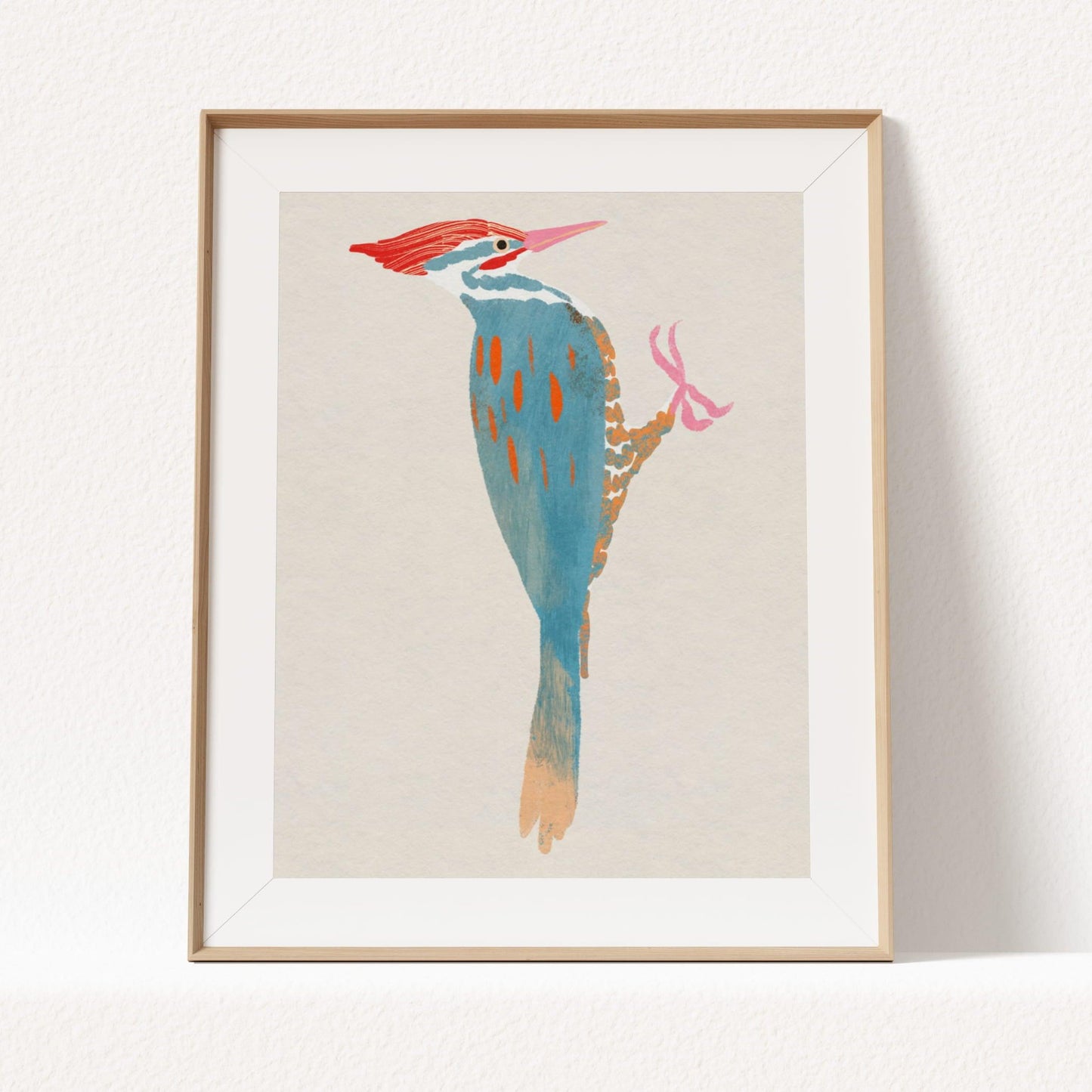 A whimsical art print of a Pileated Woodpecker, illustrated in vibrant colors and playful details. The bird is perched in a natural setting, capturing its bold features and lively spirit—an artistic tribute to this striking forest visitor.