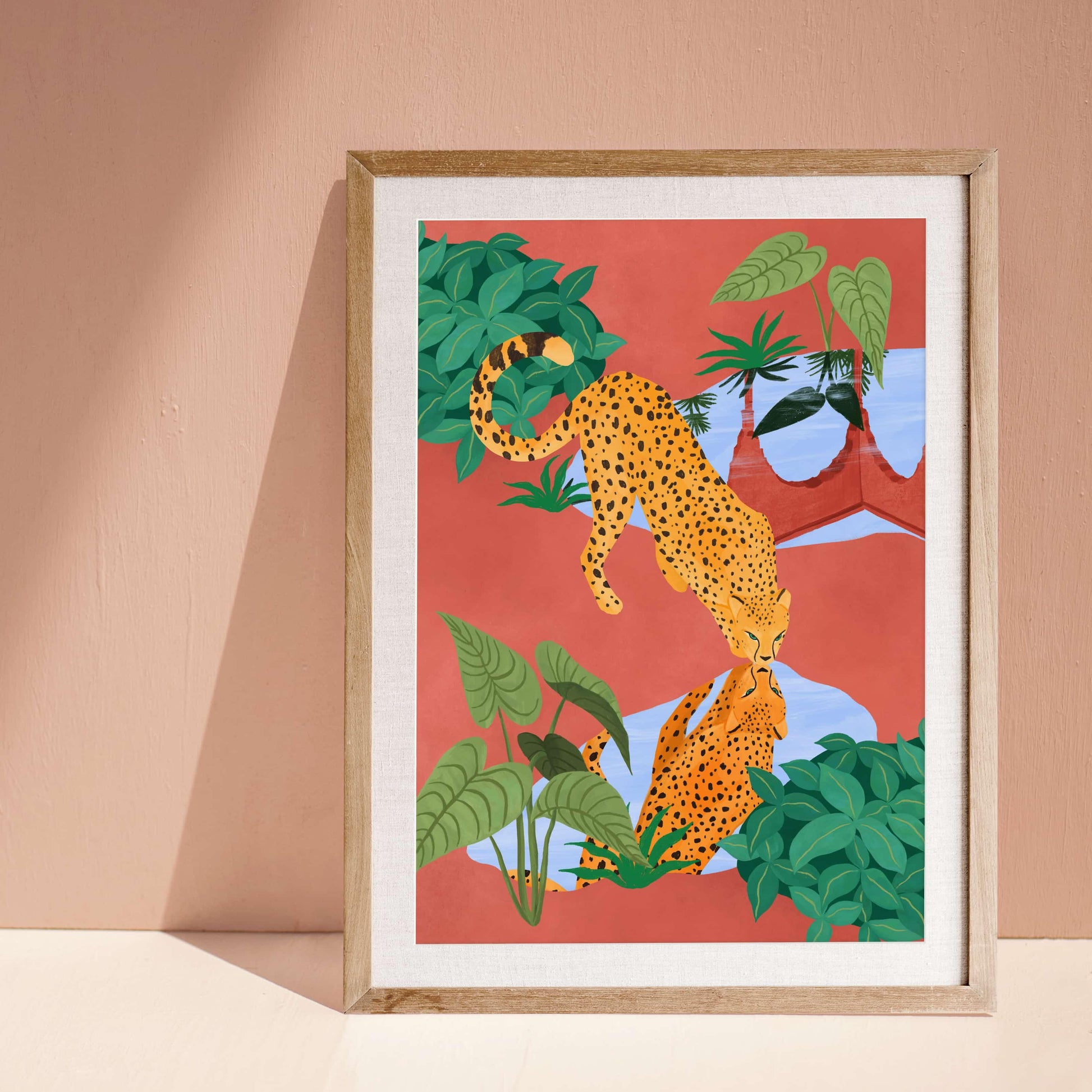 Illustration of a cheetah drinking water from a serene pond, with a beautiful reflection – earthy mud tones and vibrant greens in tranquil nature art print for modern home decor