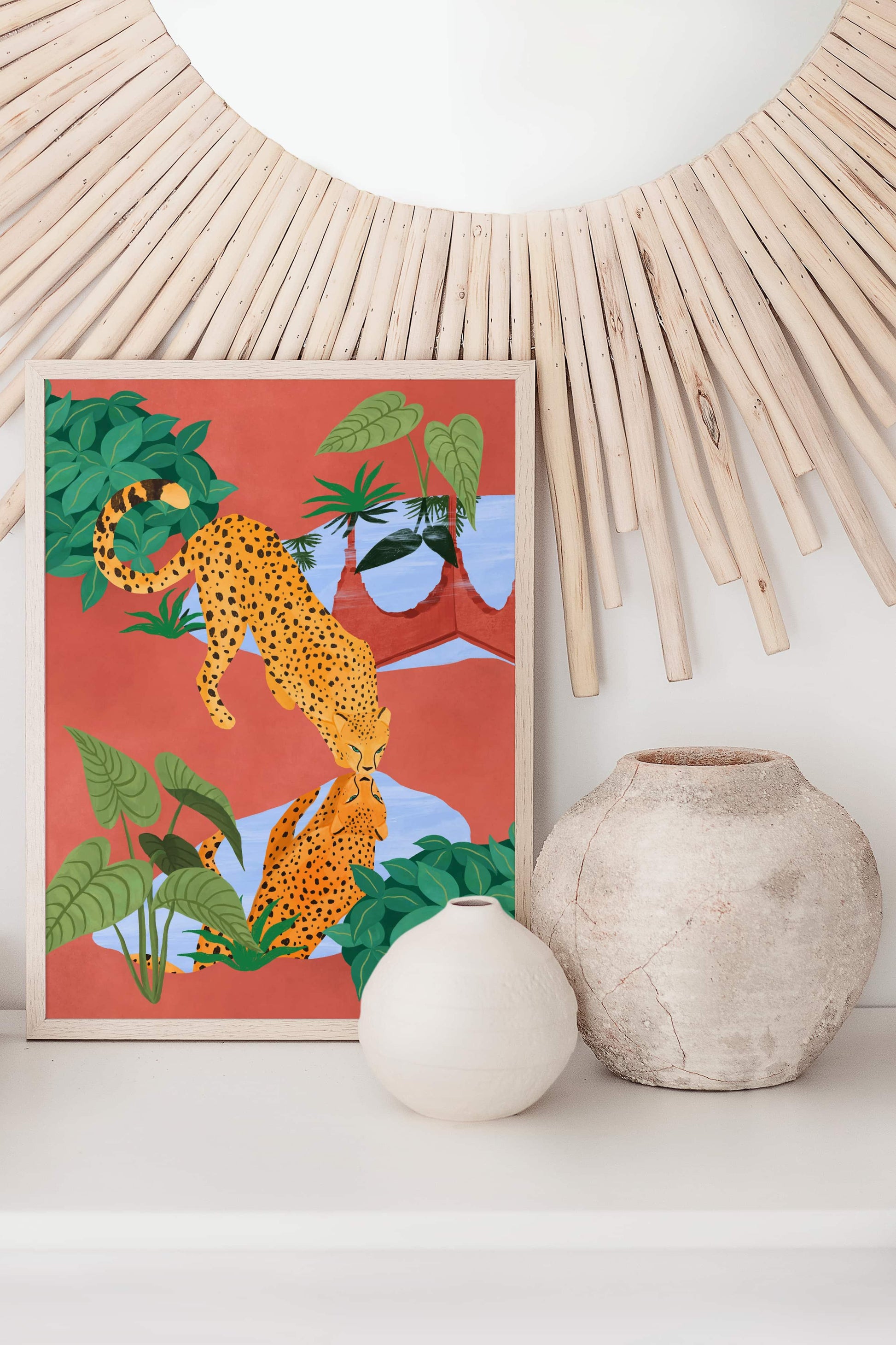 Illustration of a cheetah drinking water from a serene pond, with a beautiful reflection – earthy mud tones and vibrant greens in tranquil nature art print for modern home decor