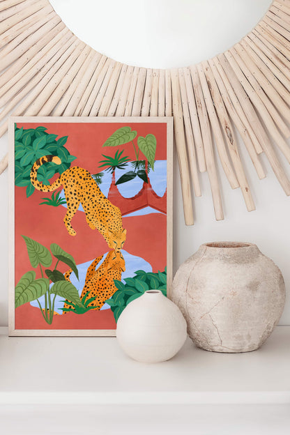 Illustration of a cheetah drinking water from a serene pond, with a beautiful reflection – earthy mud tones and vibrant greens in tranquil nature art print for modern home decor