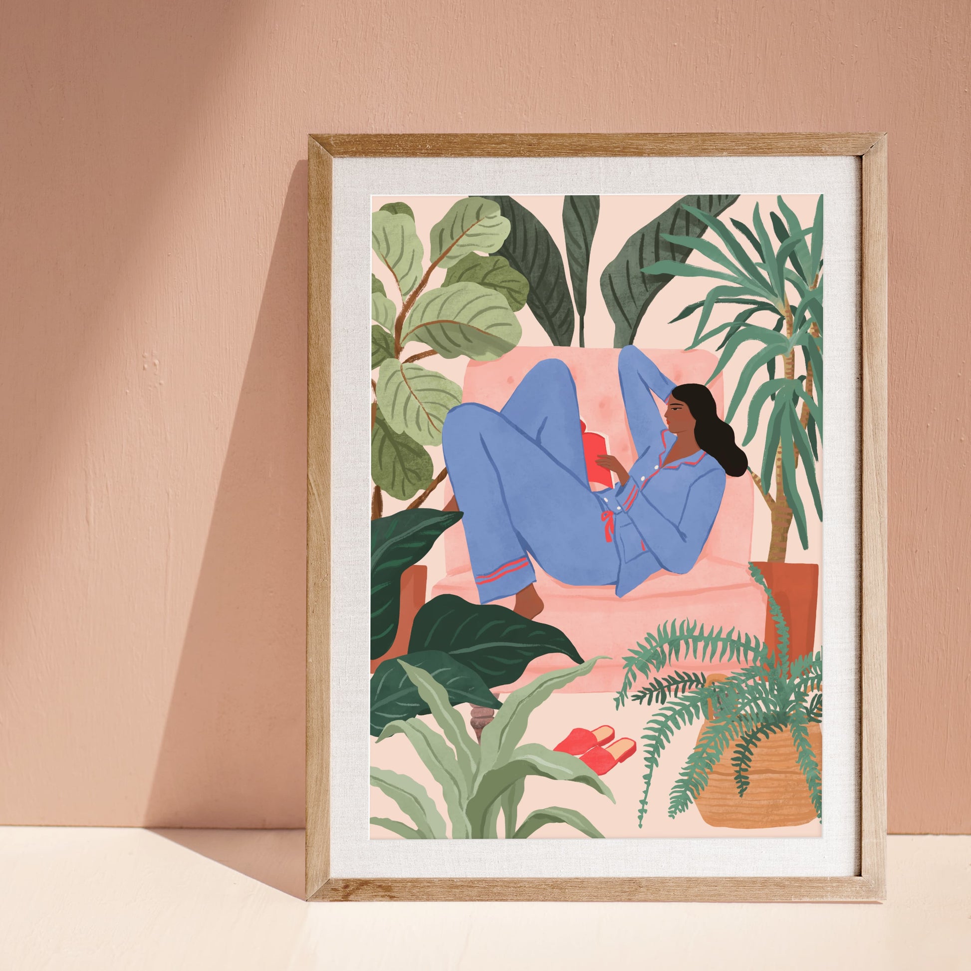 Illustration of a woman reading a book on a pink sofa surrounded by houseplants in a cozy room