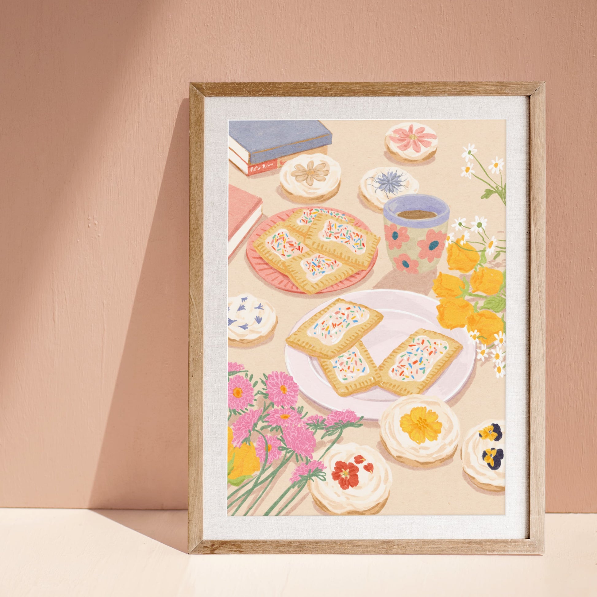 Soft illustration of a cozy table scene with books, flowers, cookies, and desserts topped with edible flowers – titled "Sweet Stillness"