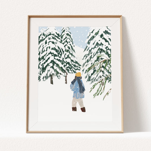 Woman walking through snowy pine trees on a quiet winter day, rear view.