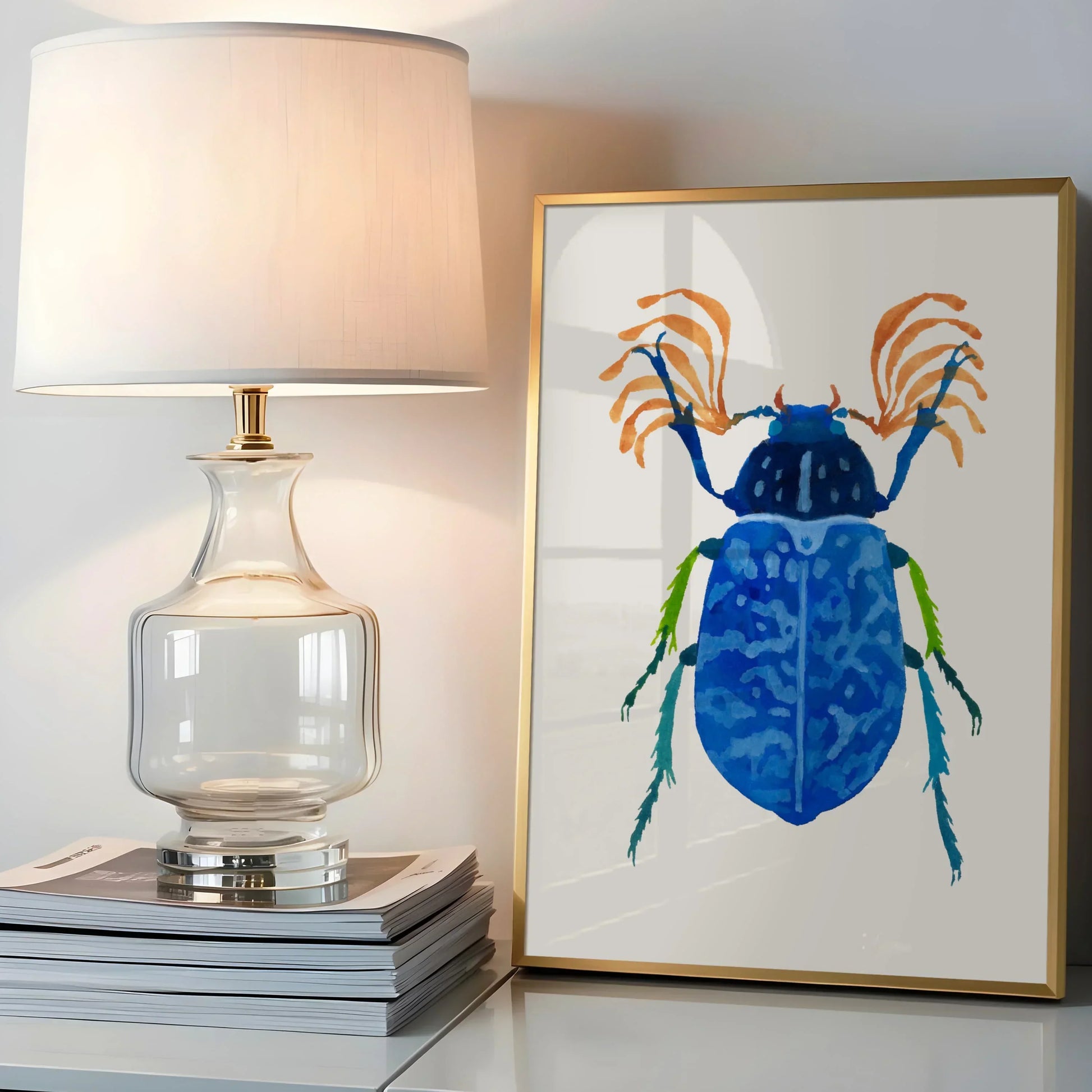 Art print of a vibrant blue beetle with detailed wings and iridescent tones, painted in gouache on textured paper. The beetle is centered against a clean background, highlighting its intricate patterns and vivid color.