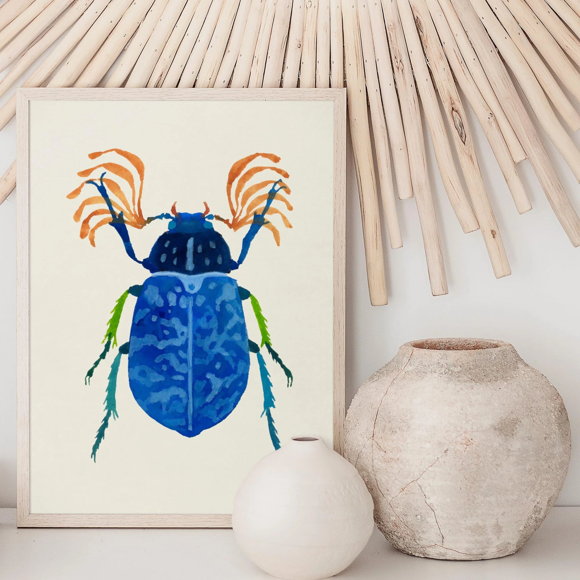 Gouache painting of a vibrant blue beetle with intricate wing details and iridescent hues, centered on a light background. The artwork highlights the beetle’s delicate textures and bold color.