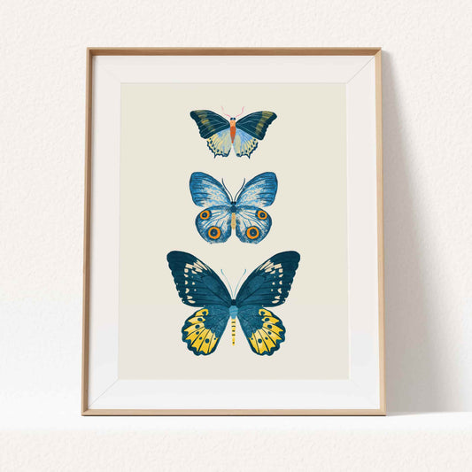 Minimal illustration of three blue butterflies with delicate wings and calm tones.