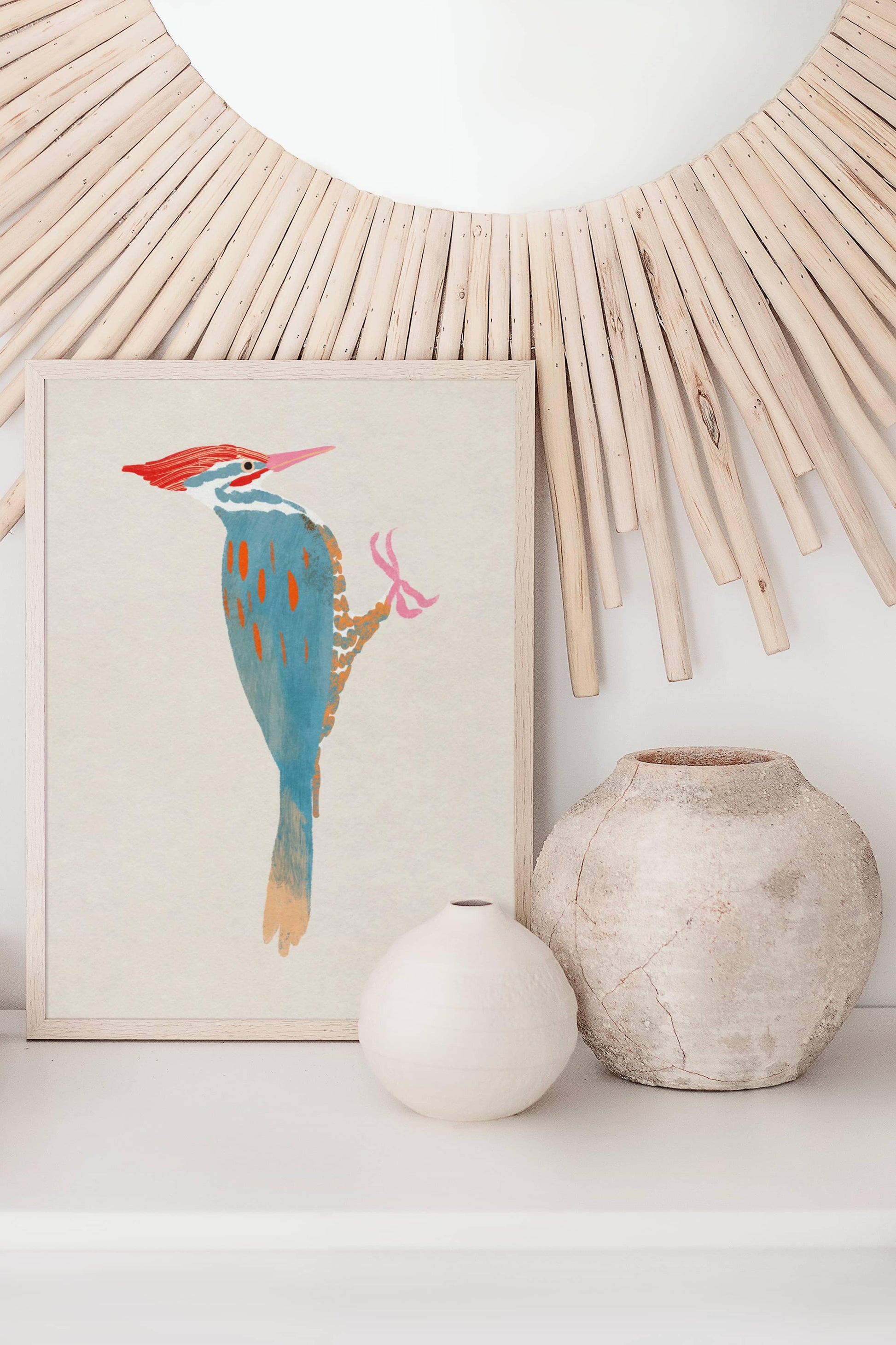 A whimsical art print of a Pileated Woodpecker, illustrated in vibrant colors and playful details. The bird is perched in a natural setting, capturing its bold features and lively spirit—an artistic tribute to this striking forest visitor.