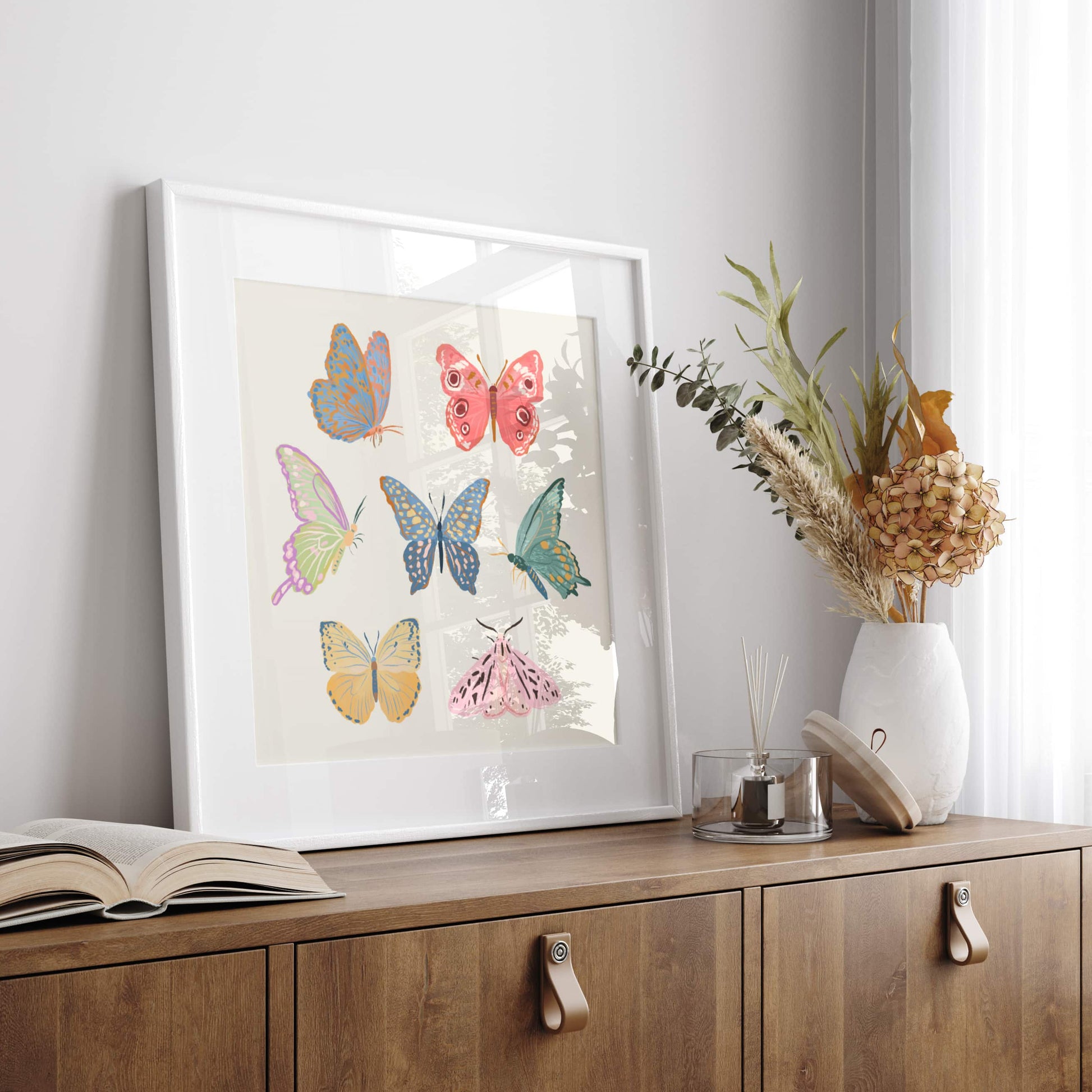Minimal, whimsical illustration of butterflies and moths in soft pastel tones.