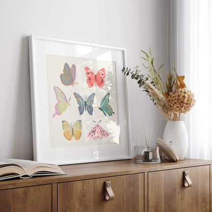 Minimal, whimsical illustration of butterflies and moths in soft pastel tones.