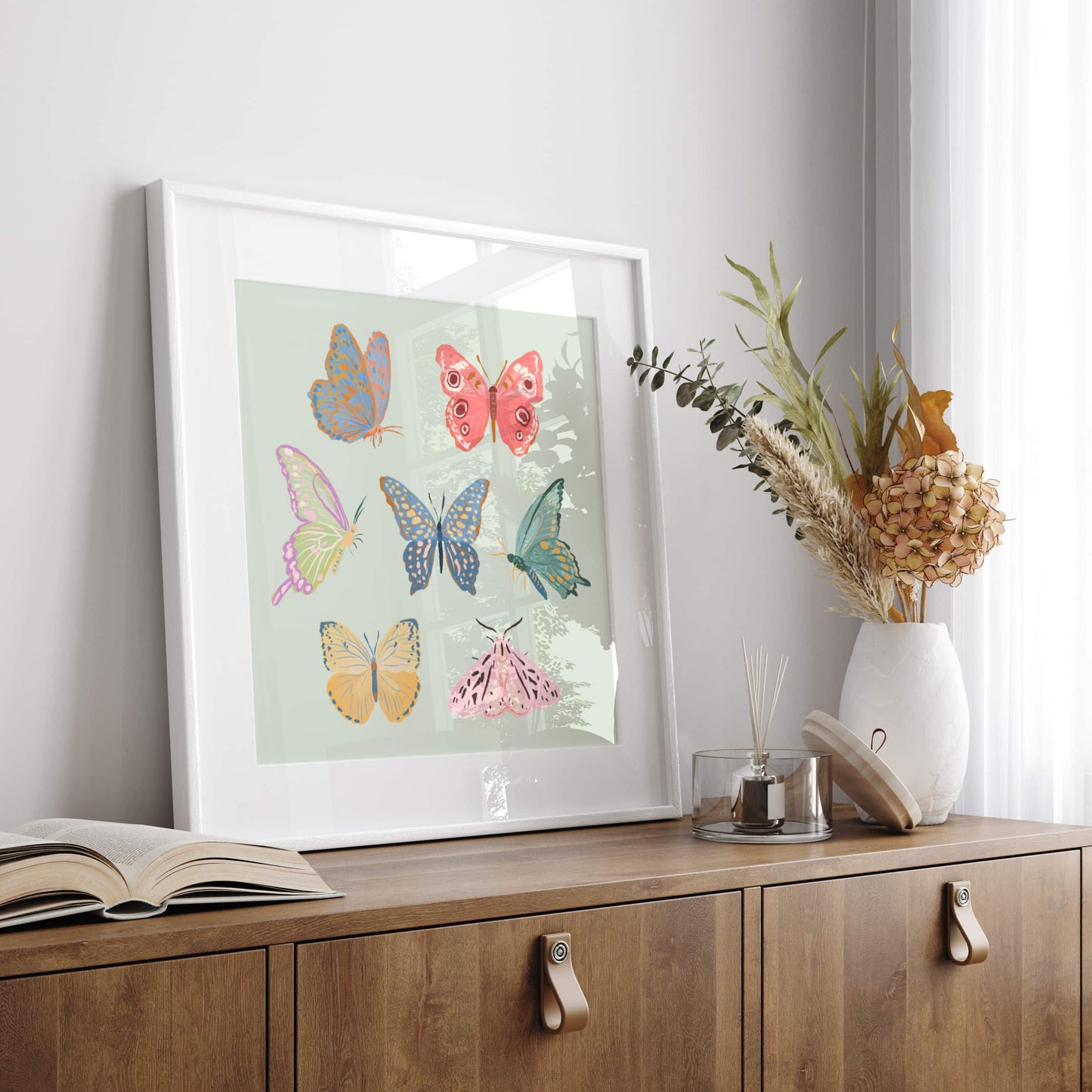 Minimal, whimsical illustration of butterflies and moths in soft pastel tones.