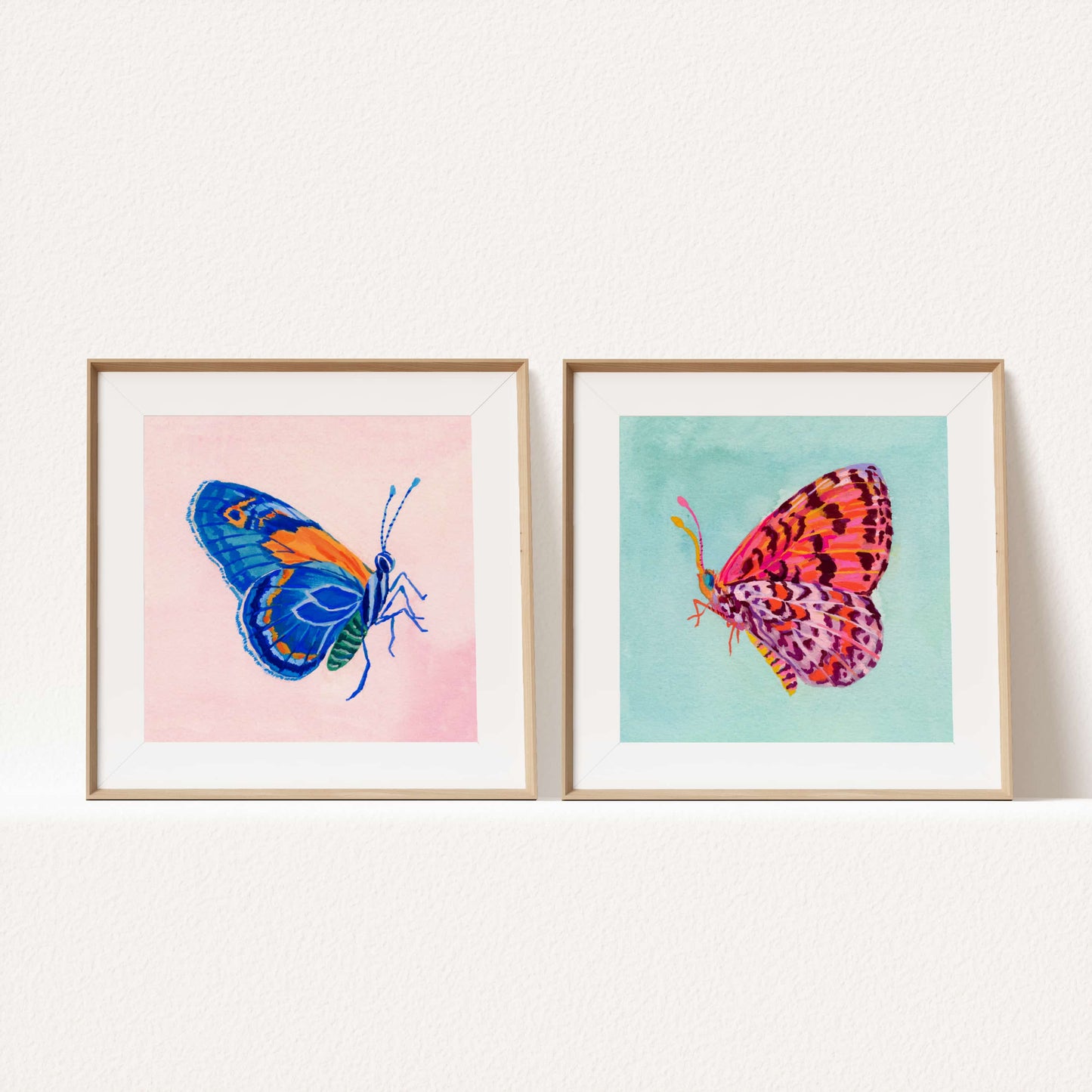 Hand-painted blue butterfly artwork with soft pink backdrop