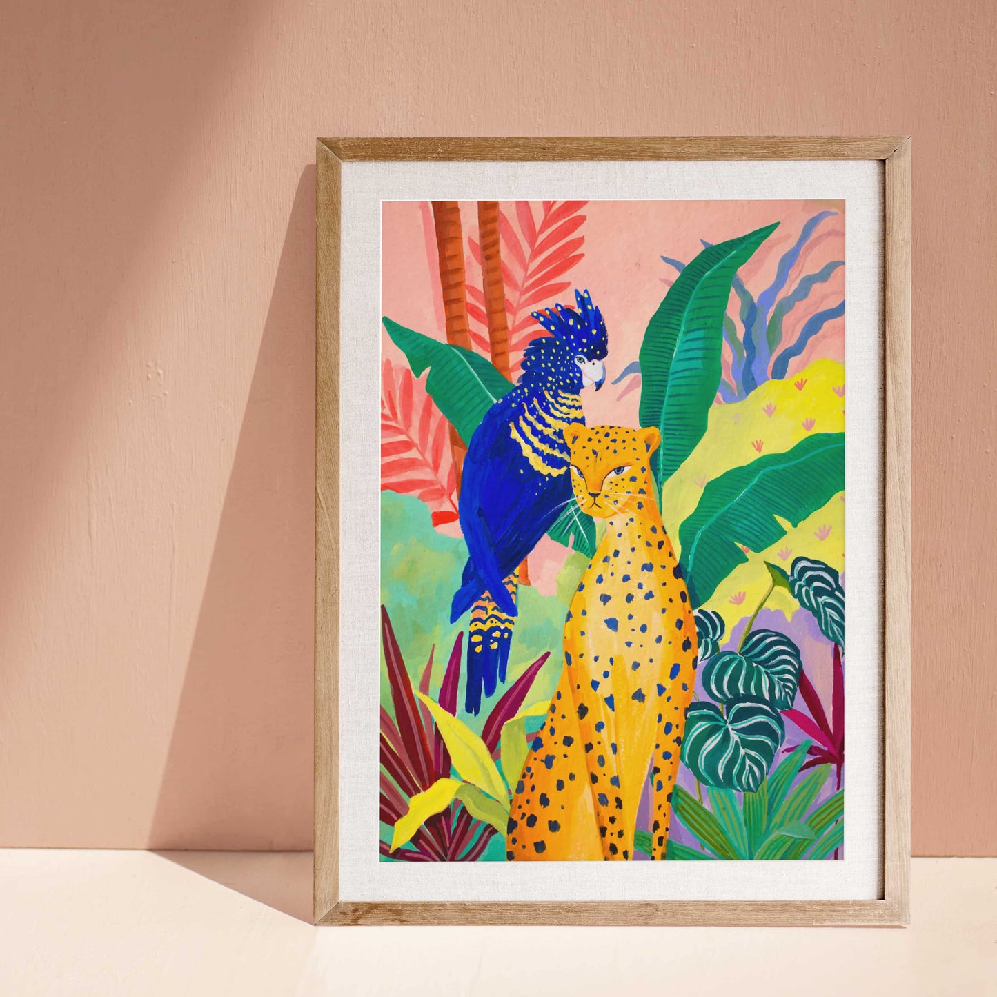 Colorful jungle art print featuring a resting cheetah, blue cockatoo, lush tropical leaves, and exotic flowers.