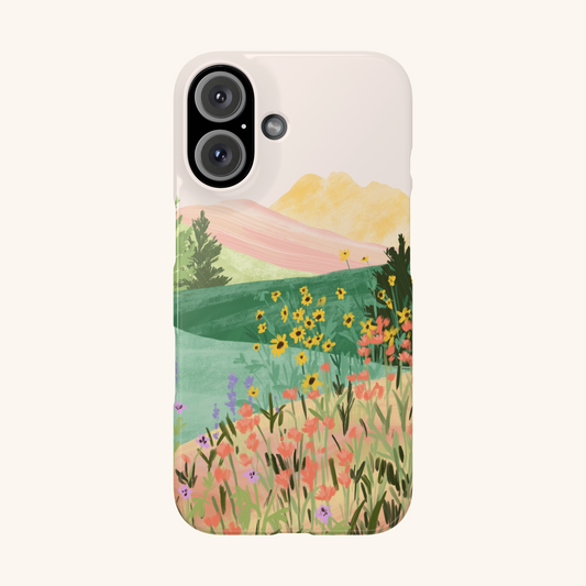 Phone case with a scenic design of mountains and flowers by Sun Lee