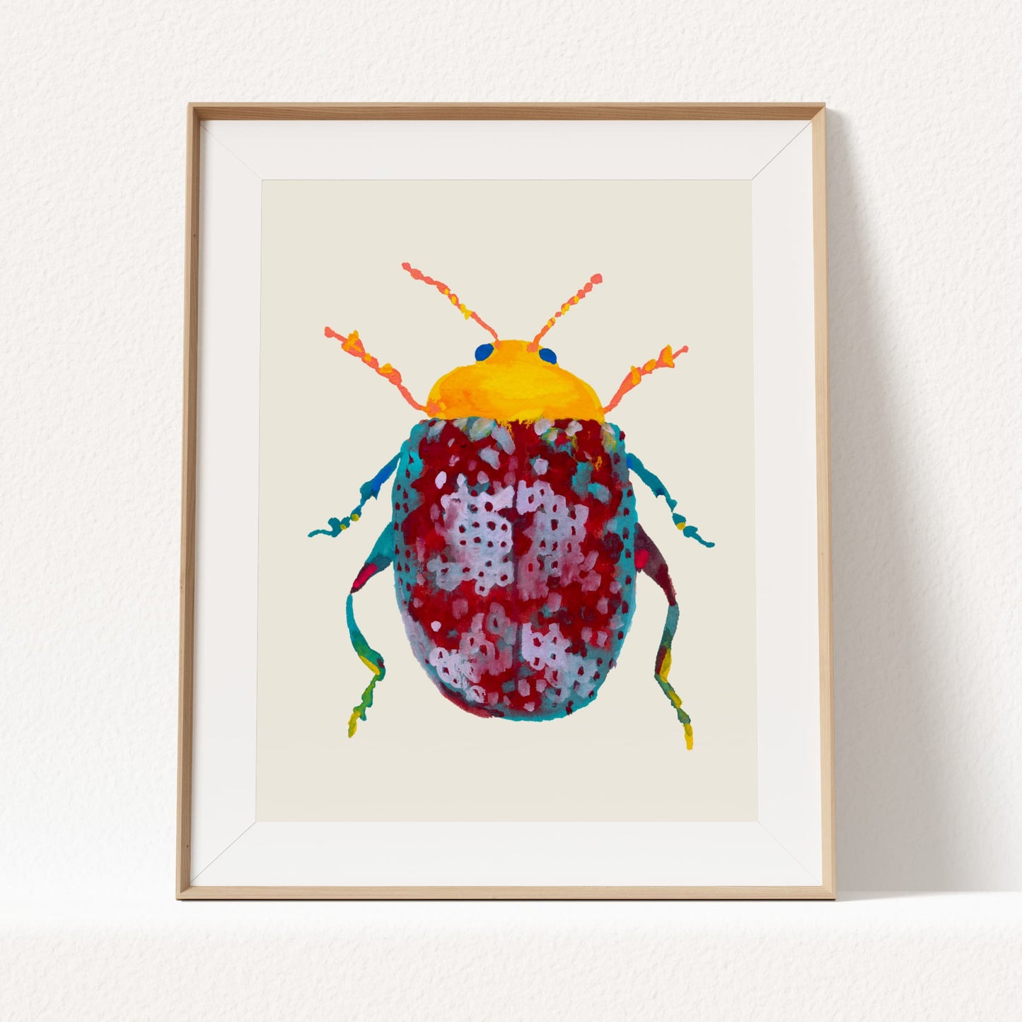 Framed artwork of a colorful beetle on a beige background