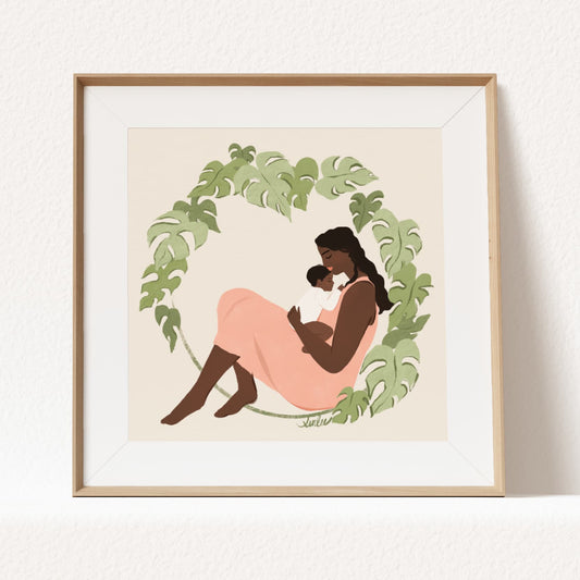 Framed artwork of a mother and child surrounded by green leaves on a beige background by Sun Lee
