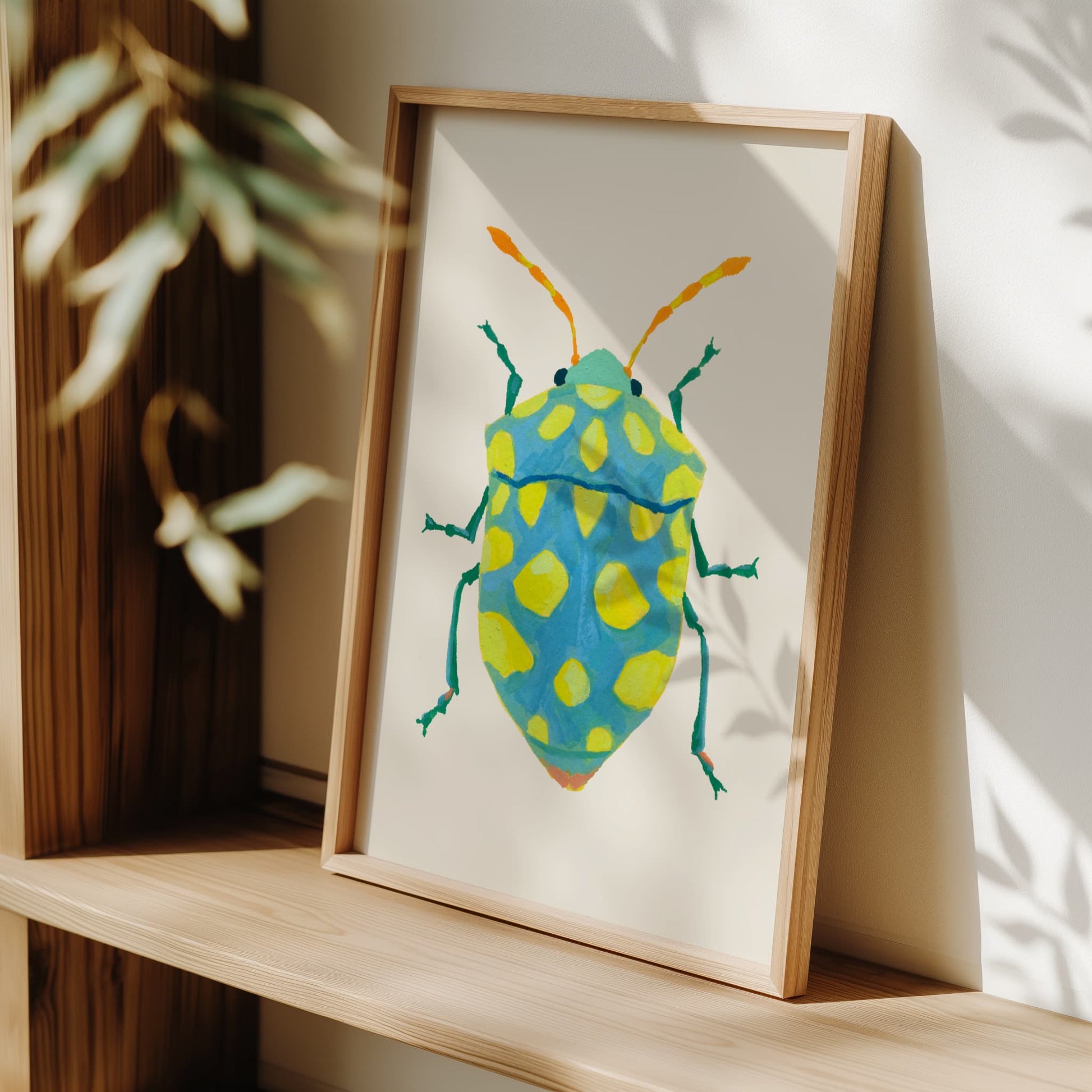 Whimsical insect illustration of a sky blue beetle featuring lime spots and striking yellow-orange antennae, hand-painted with gouache.