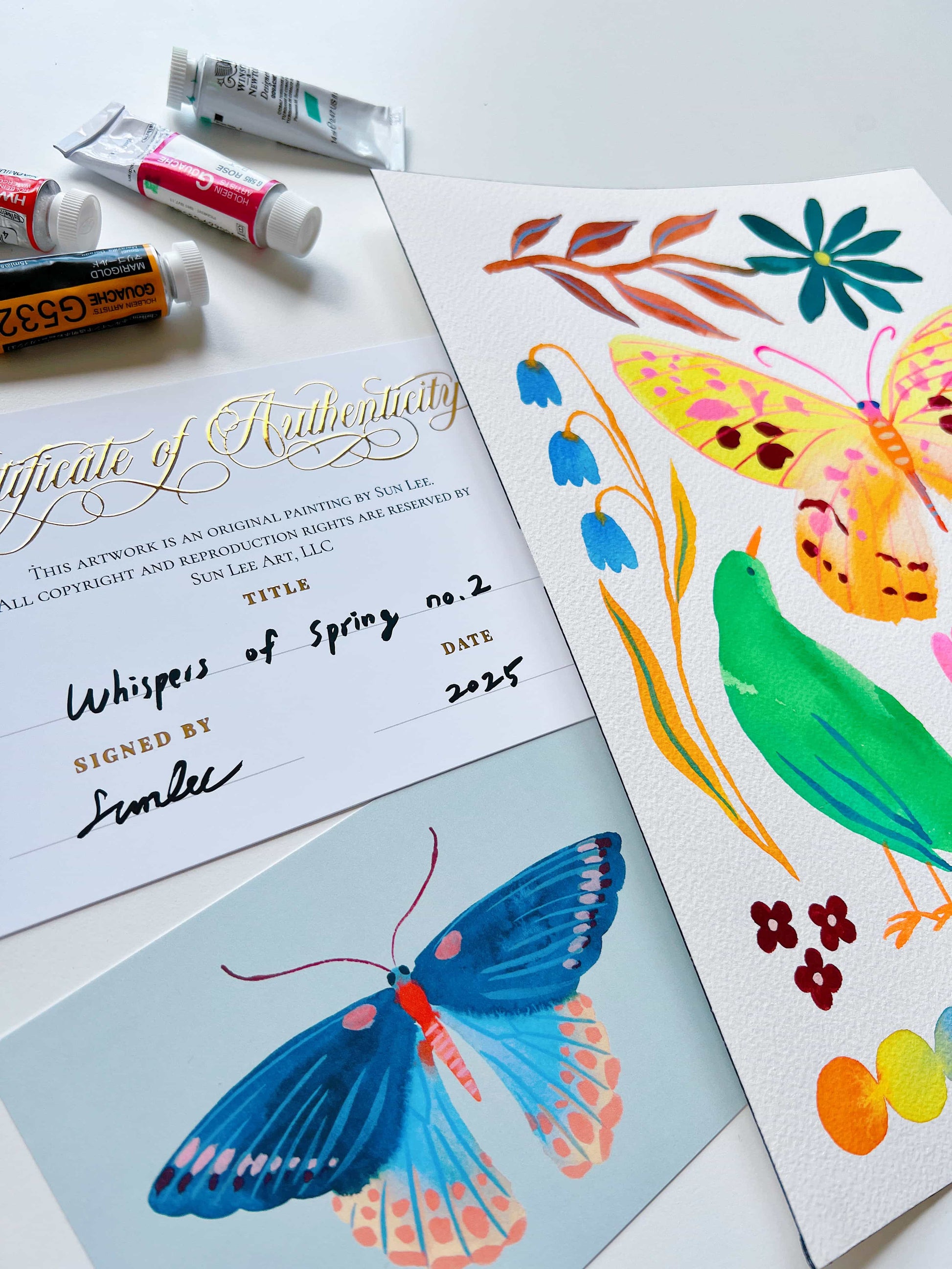 Original gouache, watercolor, and acrylic painting by Sun Lee from the 'Whispers of Spring' collection. This vibrant piece features a whimsical depiction of nature with bright flowers, butterflies, and birds, capturing the energy and beauty of spring. Perfect for nature lovers and those seeking aesthetic watercolor and gouache artwork, bringing joy and color to your space.