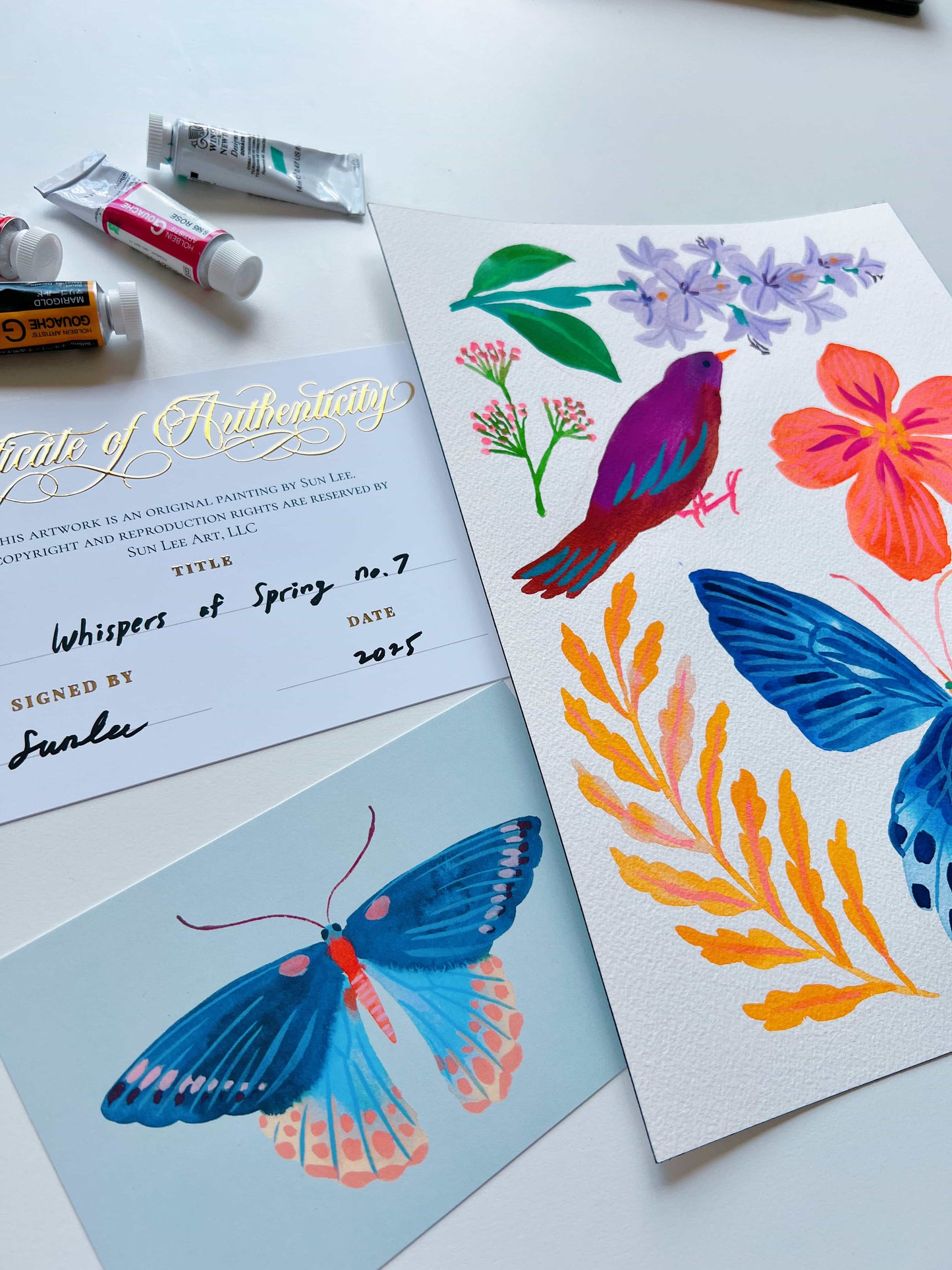 Original gouache, watercolor, and acrylic painting by Sun Lee from the 'Whispers of Spring' collection. This vibrant piece features a whimsical depiction of nature with bright flowers, butterflies, and birds, capturing the energy and beauty of spring. Perfect for nature lovers and those seeking aesthetic watercolor and gouache artwork, bringing joy and color to your space.