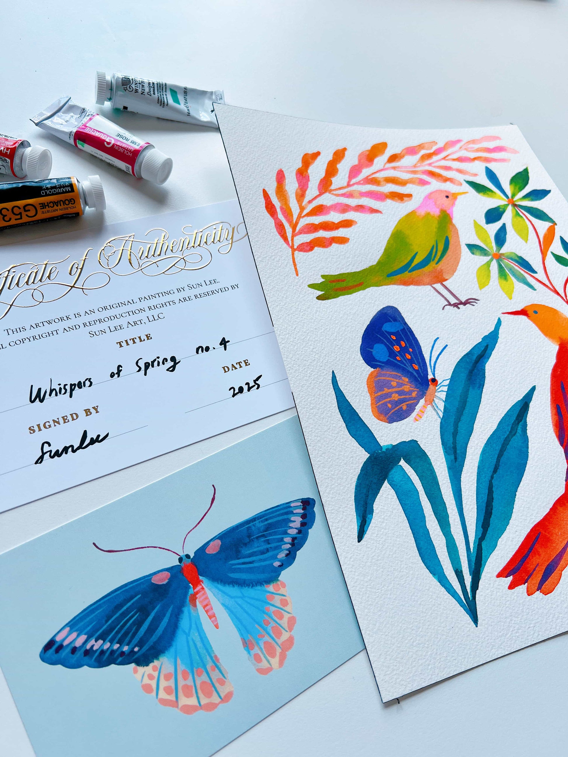 Original gouache, watercolor, and acrylic painting by Sun Lee from the 'Whispers of Spring' collection. This vibrant piece features a whimsical depiction of nature with bright flowers, butterflies, and birds, capturing the energy and beauty of spring. Perfect for nature lovers and those seeking aesthetic watercolor and gouache artwork, bringing joy and color to your space.