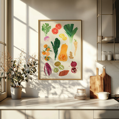 Colorful fruit and vegetable illustration in a gold frame on a kitchen wall.
